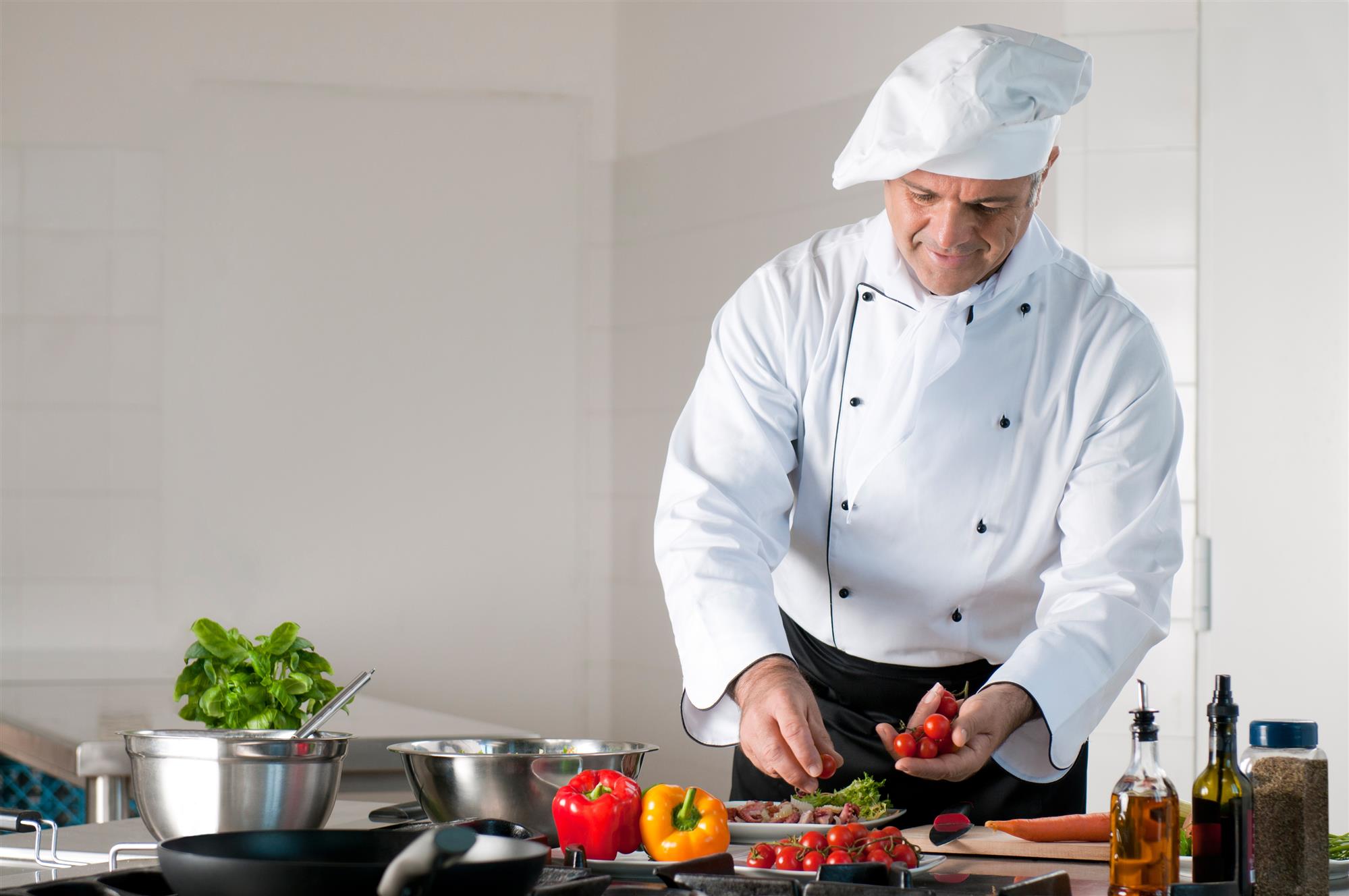 chef preparing a meal with various vegetables